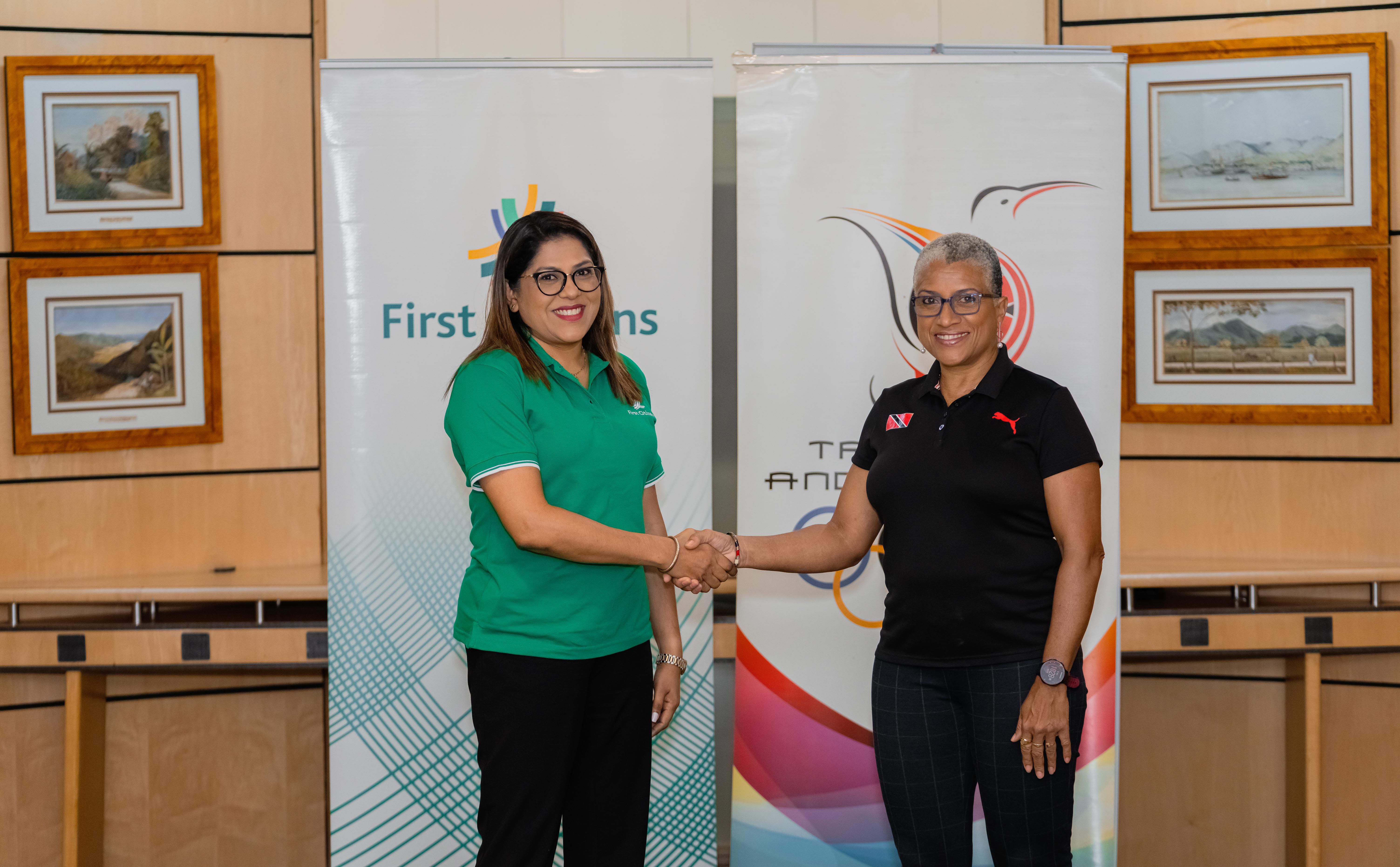 Neela Kissoon Group Deputy CEO (Designate) shakes hands with President Diane Henderson to signal another year of collaboration